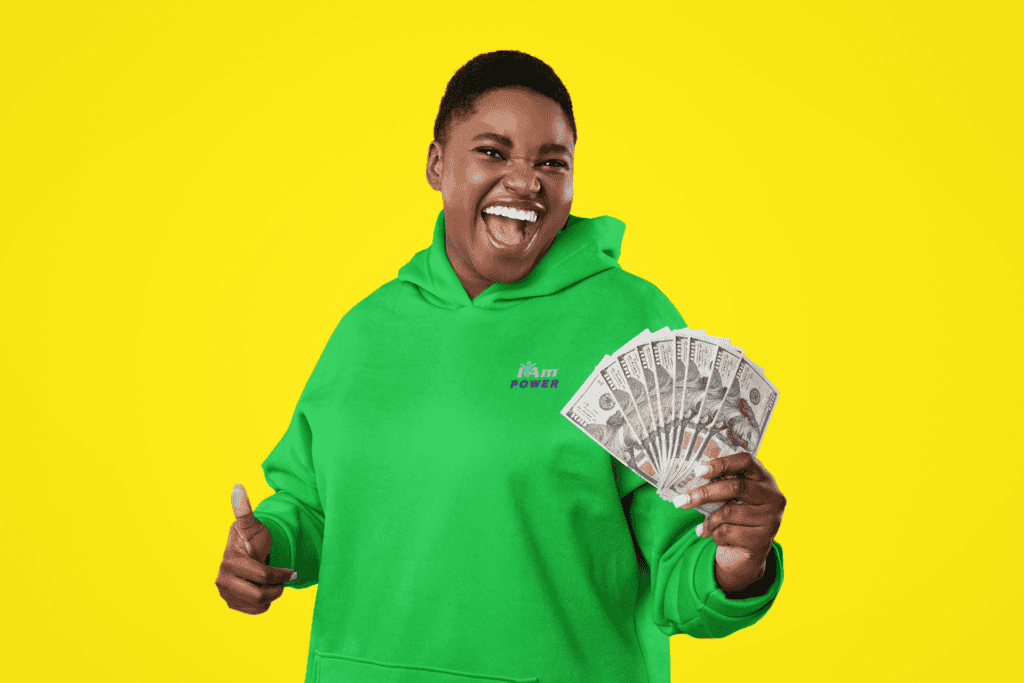 Happy woman holding cash in front of yellow background, promoting marketplace deals.