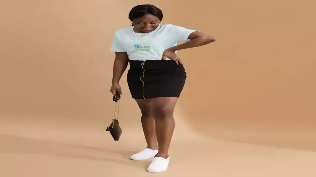 Woman holding a purse, showcasing fashion accessories at Marketplace.