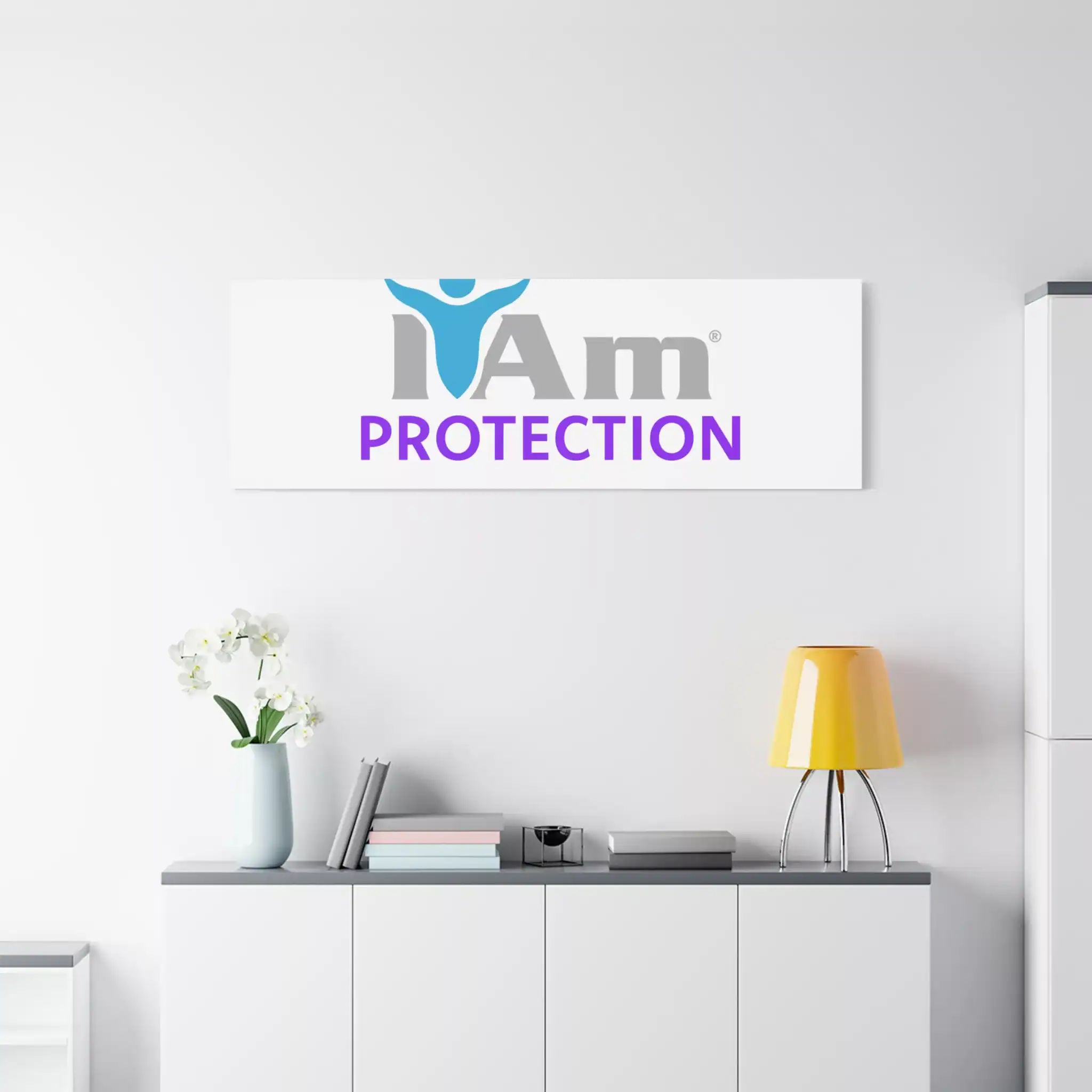 14789298398790527621_2048.webp Inspirational wall art with 'I Am Protection' message and logo on a white wall.