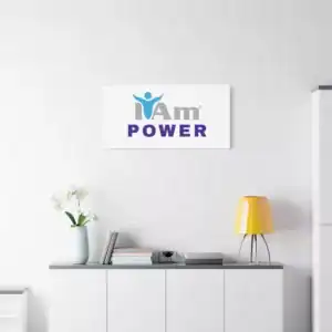 Inspirational wall art with 'I Am Power' message on a white wall.