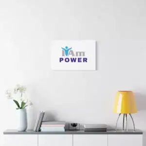 Inspirational wall art with 'I Am Power' message on a white wall.