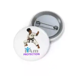 Martial artist in karate uniform with 'I Am Protection' badge for fighters and advocates.