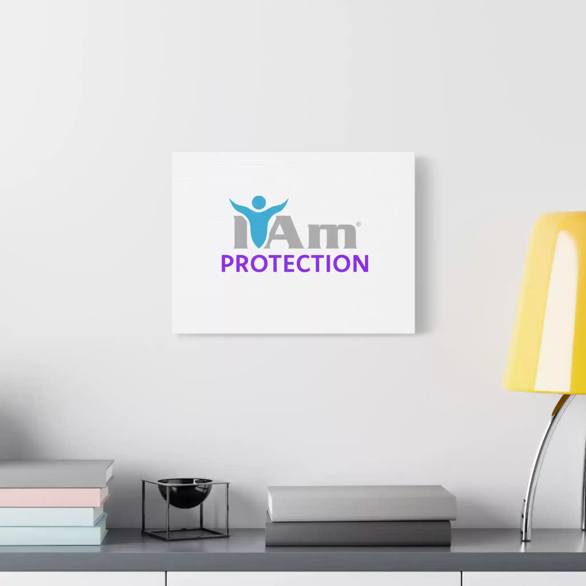 17334435736075301056_2048.webp Inspirational wall art with 'I Am Protection' message and logo on a white wall.