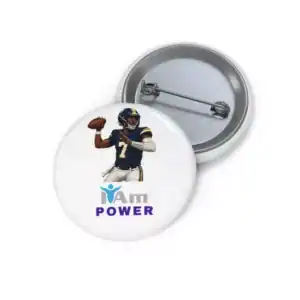 Football player badge with 'I Am Power' slogan and empowerment symbol.
