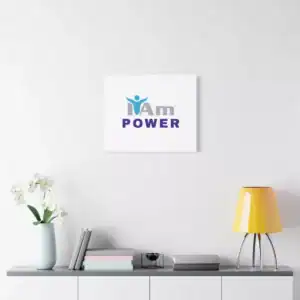 Inspirational wall art with the phrase 'I Am Power' on a white wall.