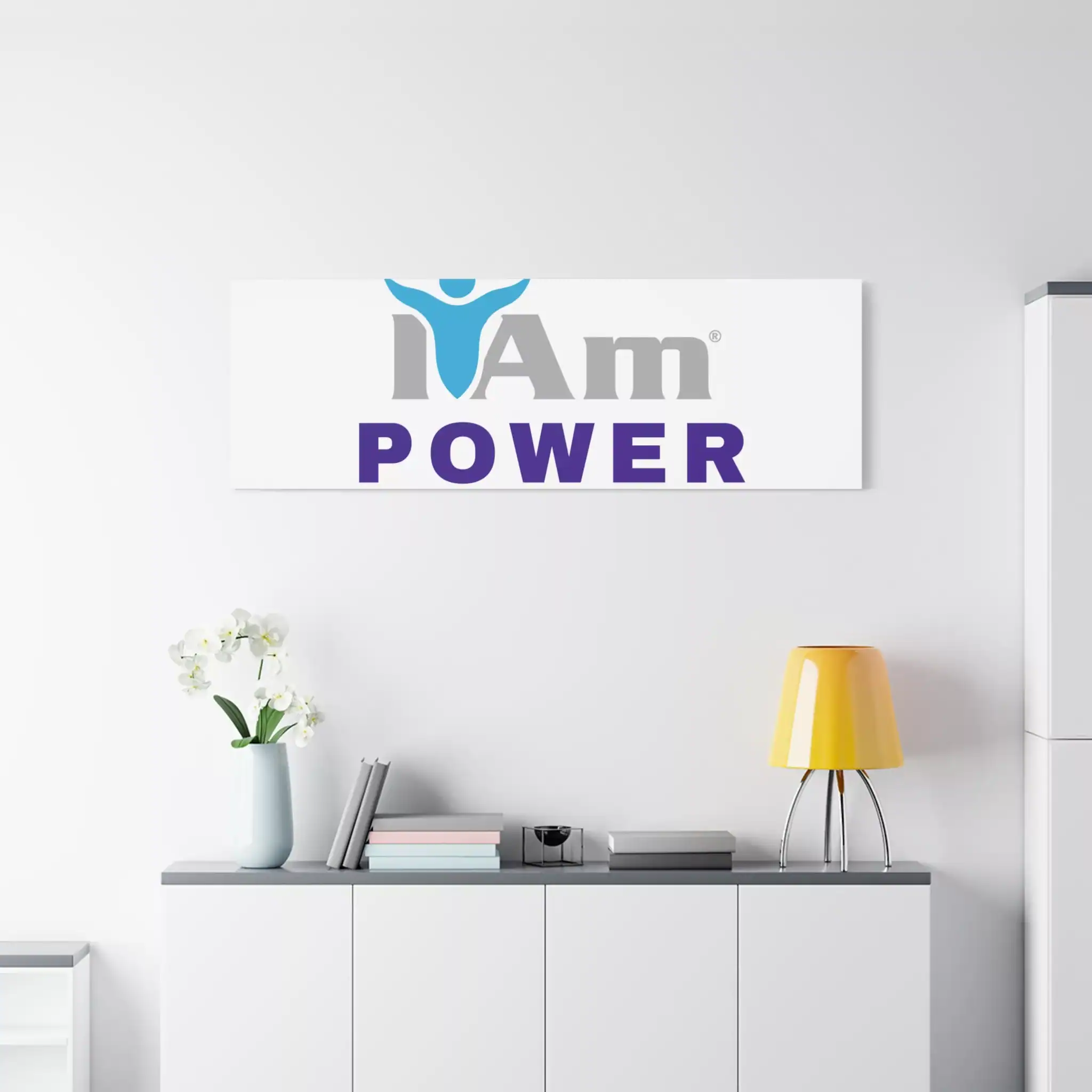 7554637798308987587_2048.webp Inspirational wall art with 'I Am Power' message and logo on a white wall.