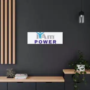 Inspirational wall art with 'I Am Power' message on a dark wall.