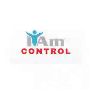 Inspirational wall art with 'I Am Control' message and a human figure icon.