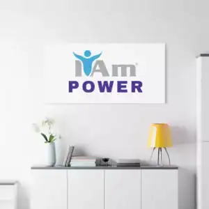 Inspirational wall art with 'I Am Power' message and logo on a white wall.