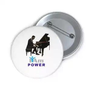 Musician playing piano with 'I Am Power' badge for performers.