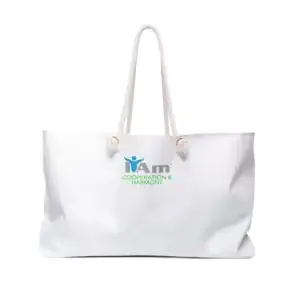 White canvas tote bag with 'I Am Cooperation and Harmony' logo and handles.